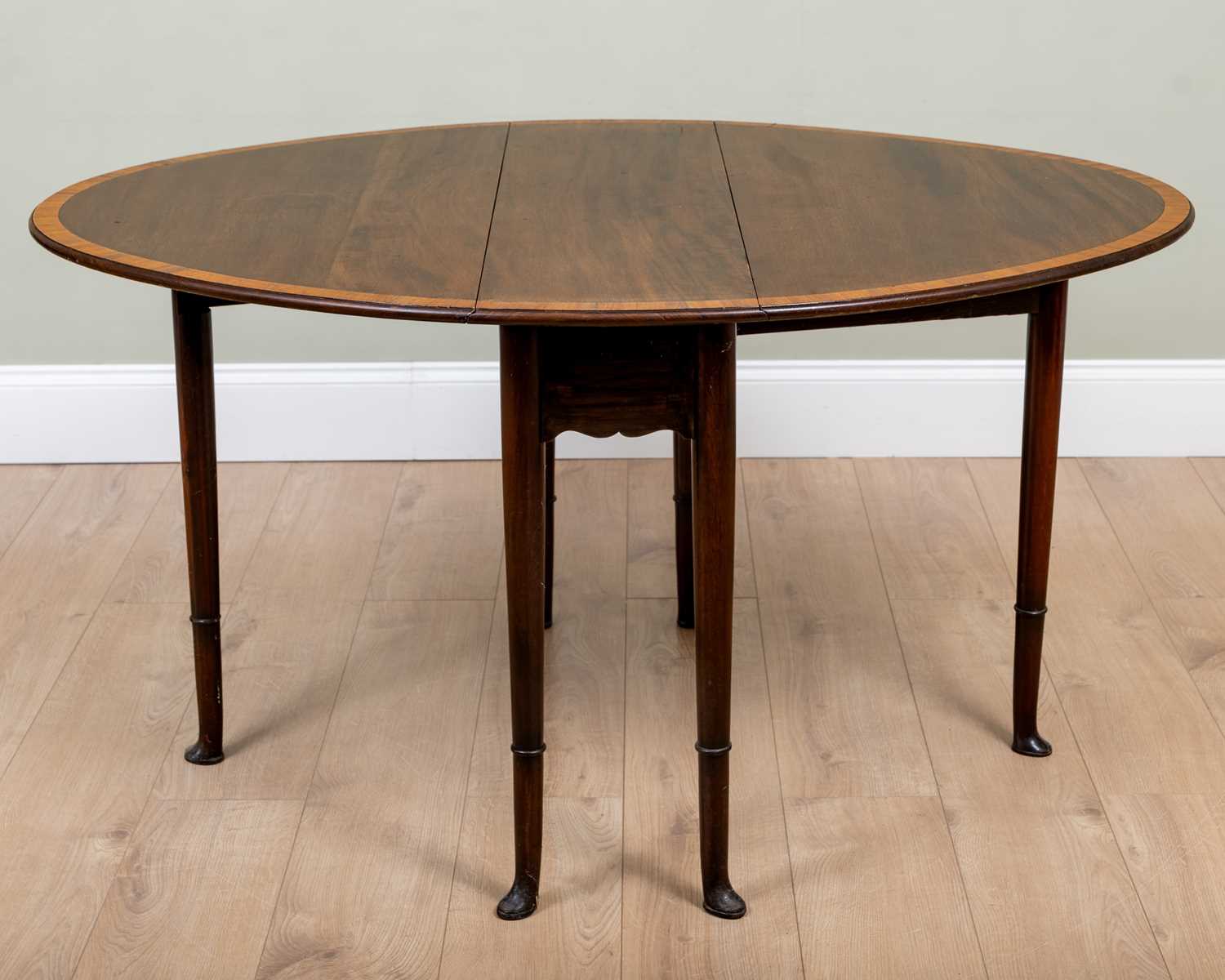 A 19th century mahogany drop leaf oval table with satinwood cross banded ornament and ring turned - Image 2 of 3