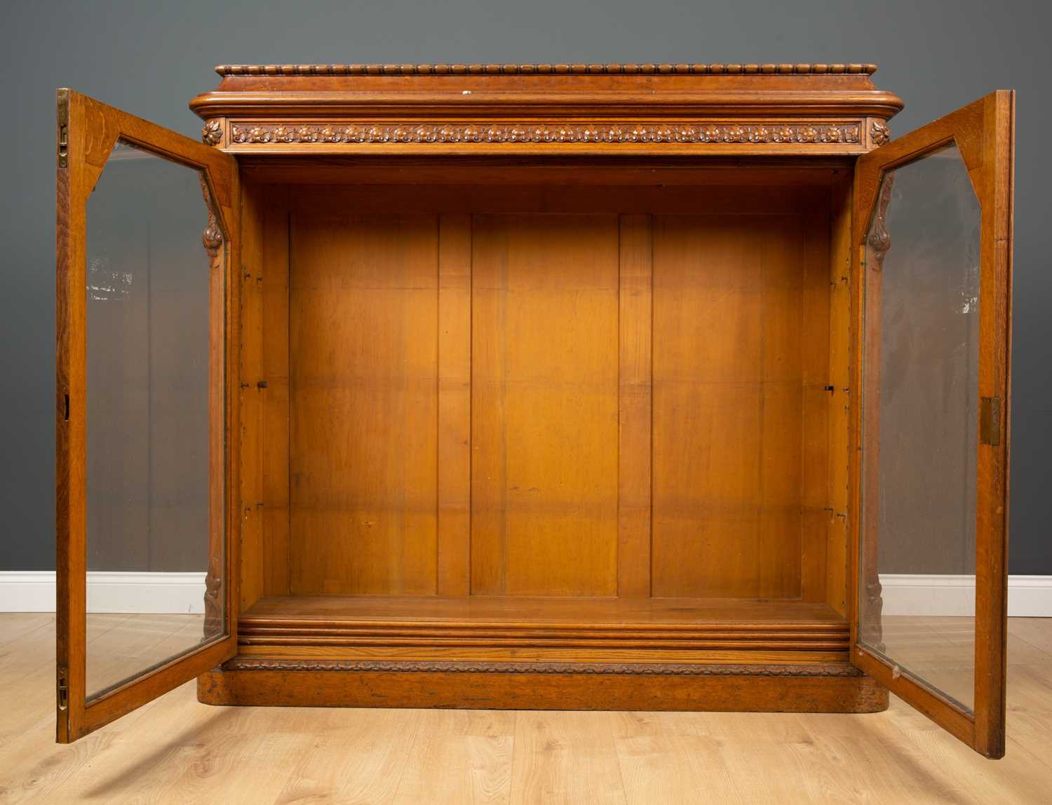 A Victorian oak bookcase with twin glazed doors, two adjustable shelves and a plinth base, 152cm - Image 2 of 5