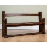 An 18th century elm child's pew, 103cm long x 24cm deep x 60cm high