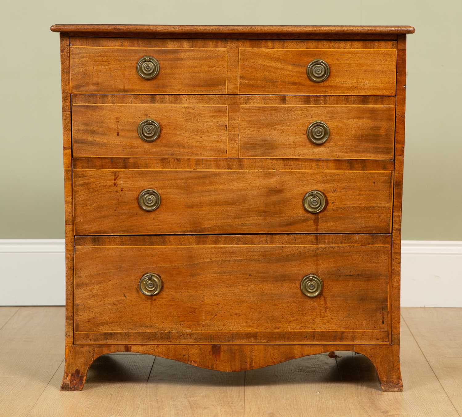 A small mahogany chest of four drawers on splayed bracket feet, 68.5cm wide x 42cm deep x 70cm highA