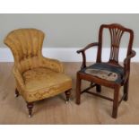 An early 19th century mahogany child's elbow chair with pierced splat, drop in seat and square