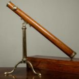 A 19th century mahogany and brass library telescope by Dolland, London, with tripod stand and