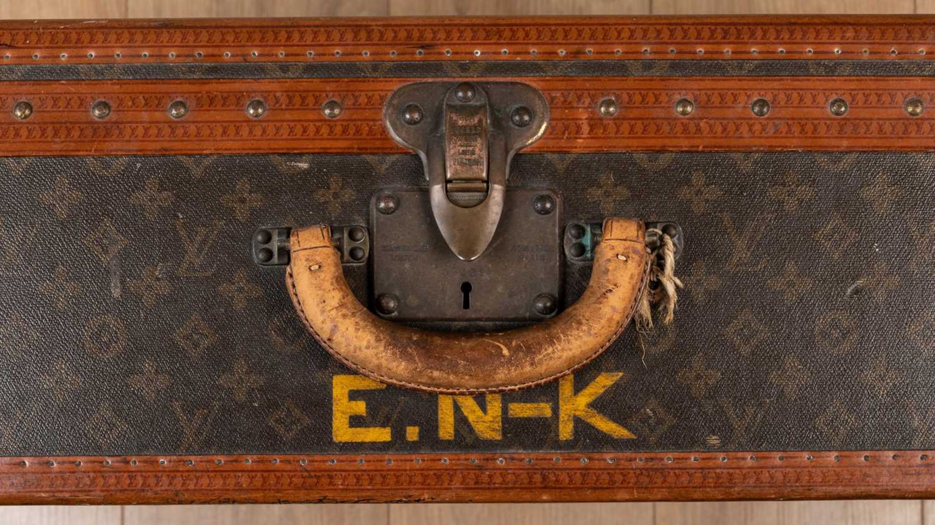 A vintage Louis Vuitton suitcase, early 20th century, with leather carrying handle, the lock - Image 10 of 11