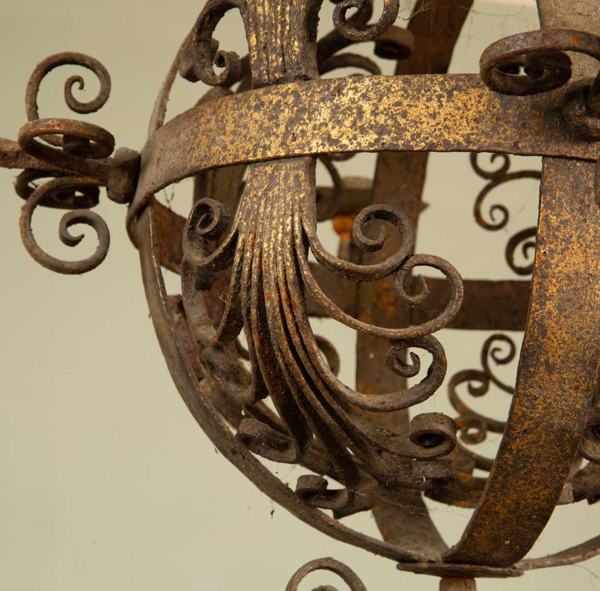 An early 20th century wrought iron hanging chandelier, the central globe with four branches and - Image 2 of 4