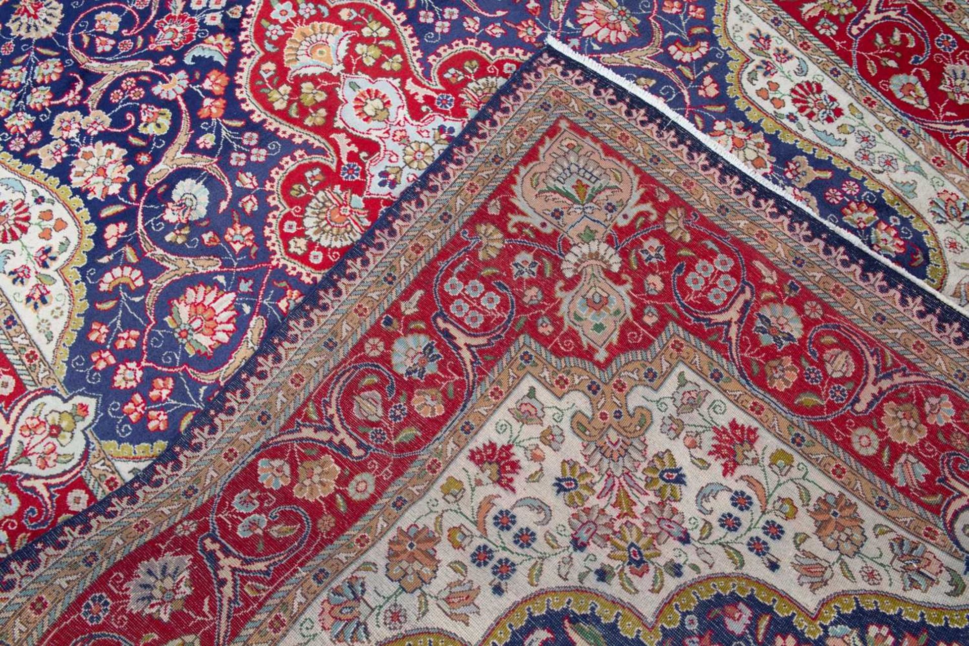 A Tabriz blue ground rug with stylised foliage, 300cm x 200cm Minor marks, otherwise good condition. - Image 2 of 2