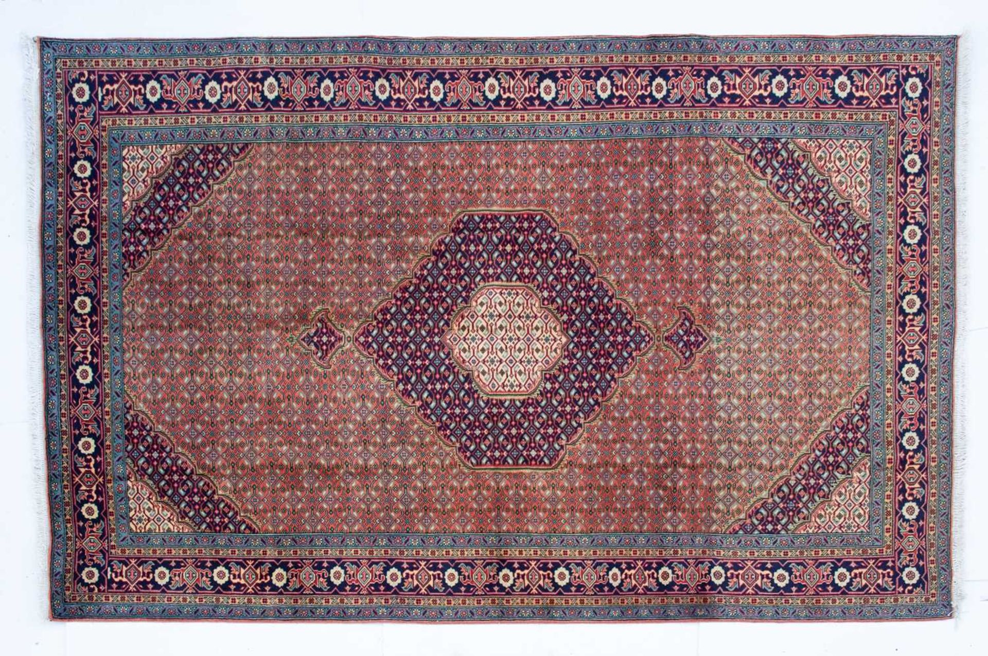 A Tabriz small carpet with geometric motifs to the central field, 290cm x 197cm Minor marks due to