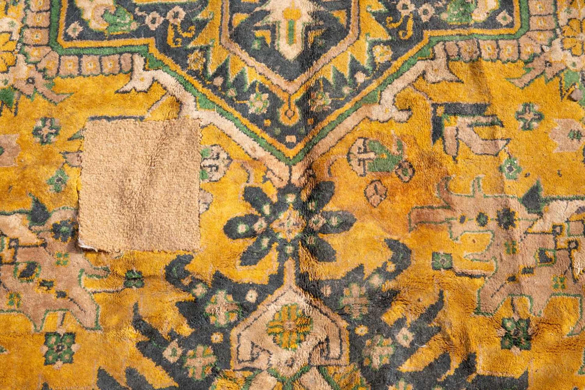 A modern 20th century blue and yellow ground small carpet, decorated with geometric designs within a - Image 2 of 4