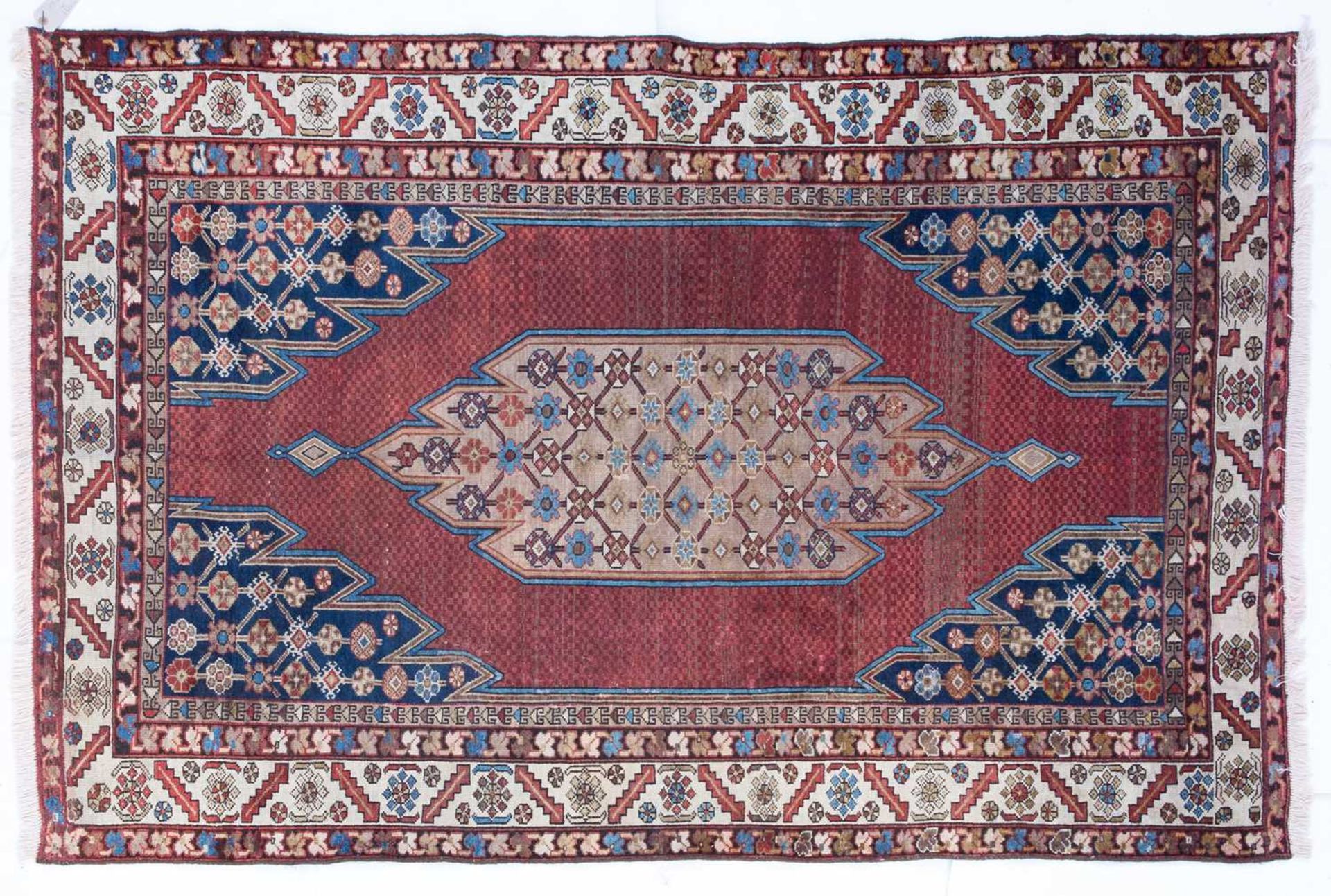 An old Maszlagn red and blue ground rug, 197cm x 131cm