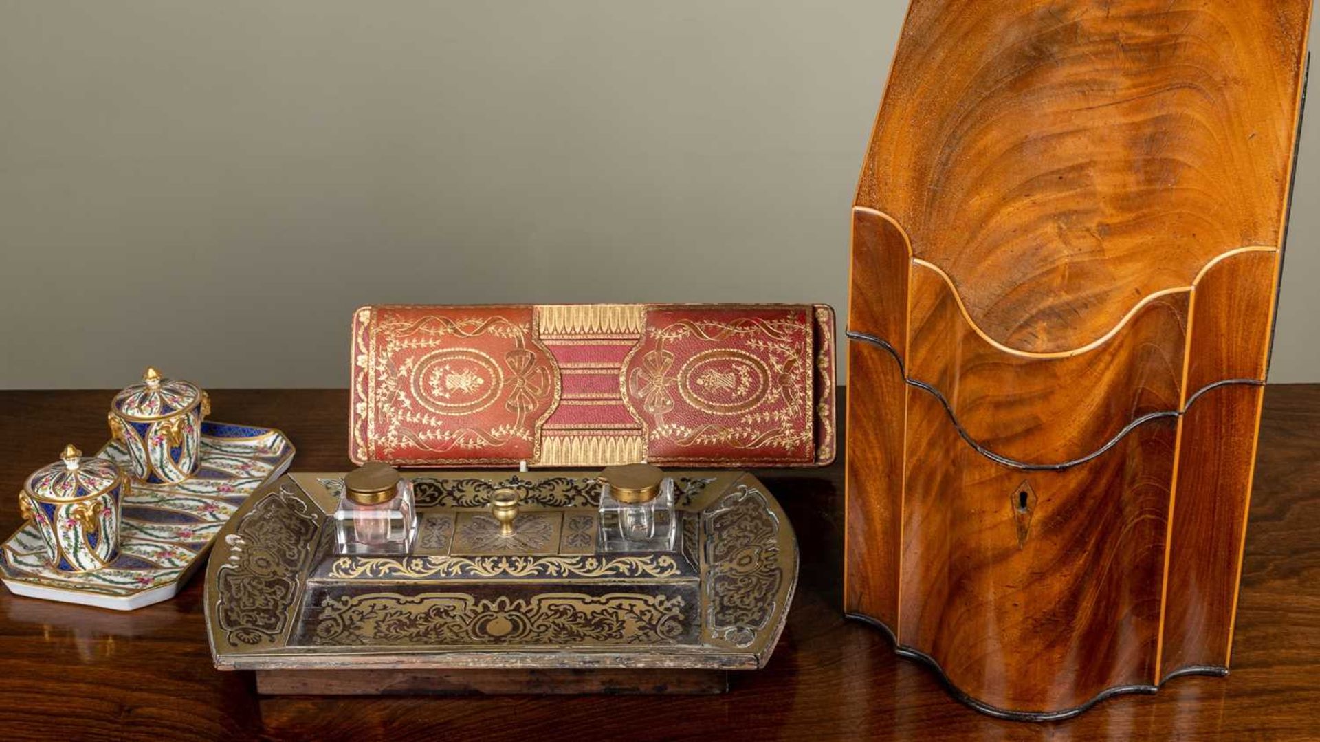 An early 19th century mahogany serpentine fronted knife box converted for use as a correspondence