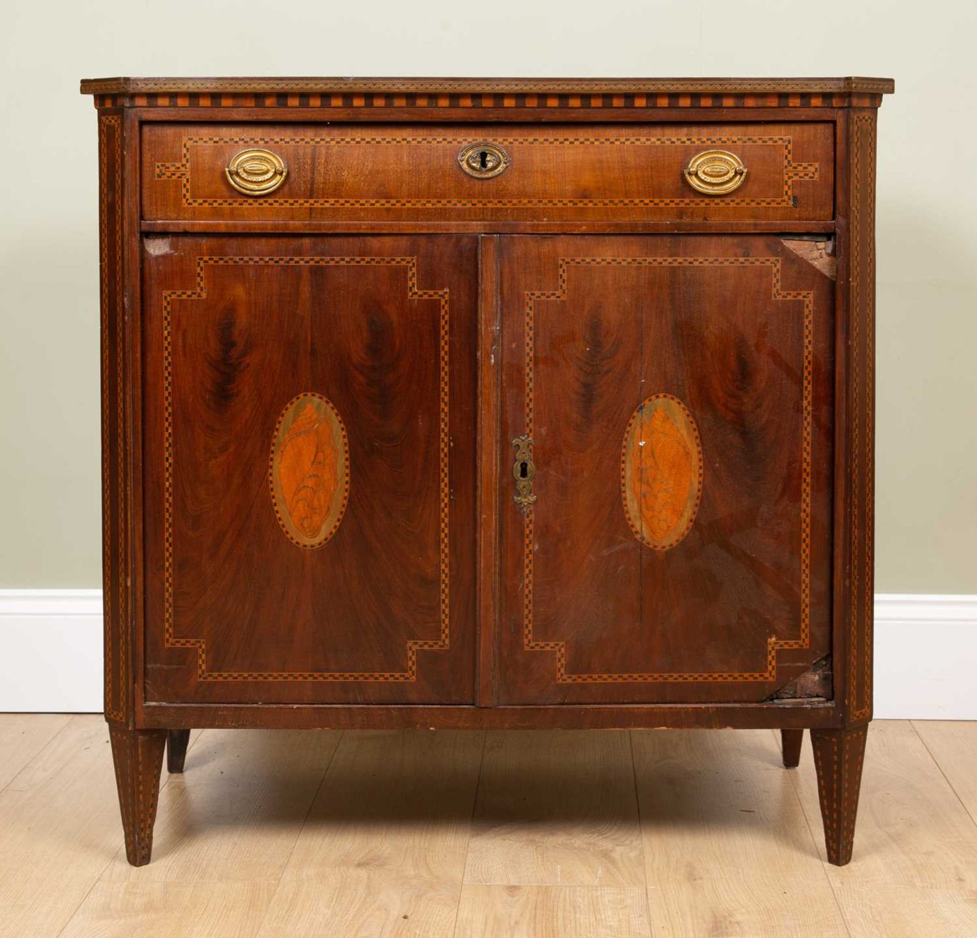 A continental mahogany side cabinet with decorative inlay to the doors and sides to include