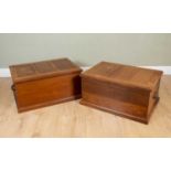 A pair of walnut boxes or chests, with hinged lids and shell carved handles to the sides, each