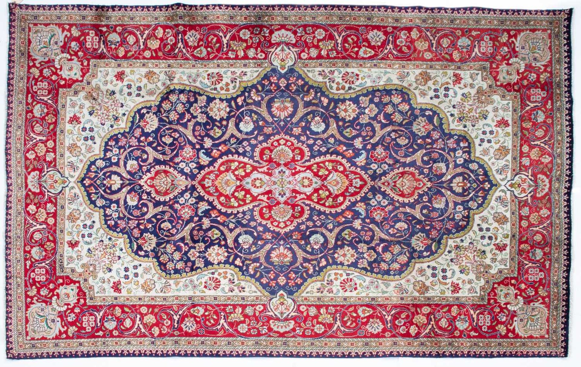 A Tabriz blue ground rug with stylised foliage, 300cm x 200cmMinor marks due to use otherwise good