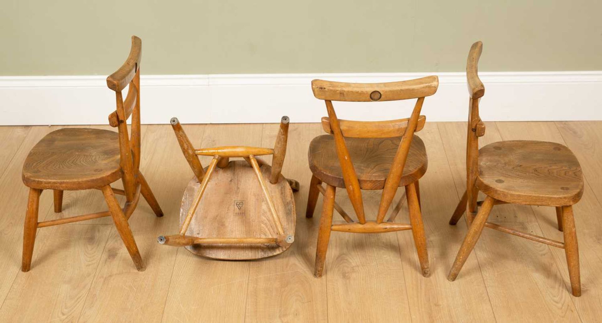 A set of four child-sized Ercol light elm chairs with blank cartouche dots to the reverse, - Image 2 of 4