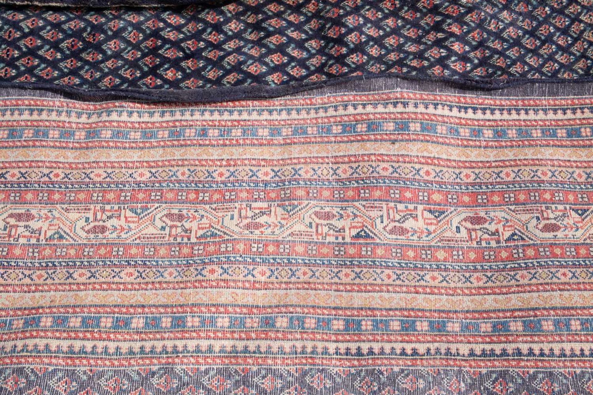 A modern Oriental blue ground carpet decorated with a mass of small, stylised flowers over the - Image 3 of 3