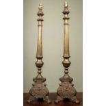 A pair of tall brass table lamps in the Continental style with fluted columns and cast tri-form