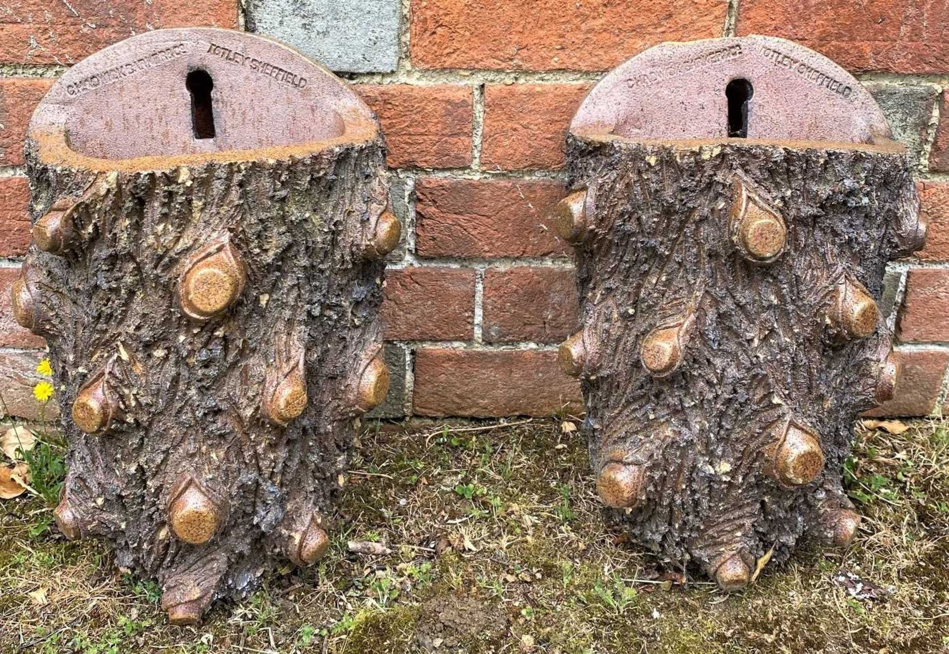 A near pair of late Victorian Chadwick Barker & Co salt glazed wall pockets of naturalistic form,