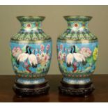 A pair of modern Japanese cloisonné vases of blue ground, decorated with cranes and flowers, each