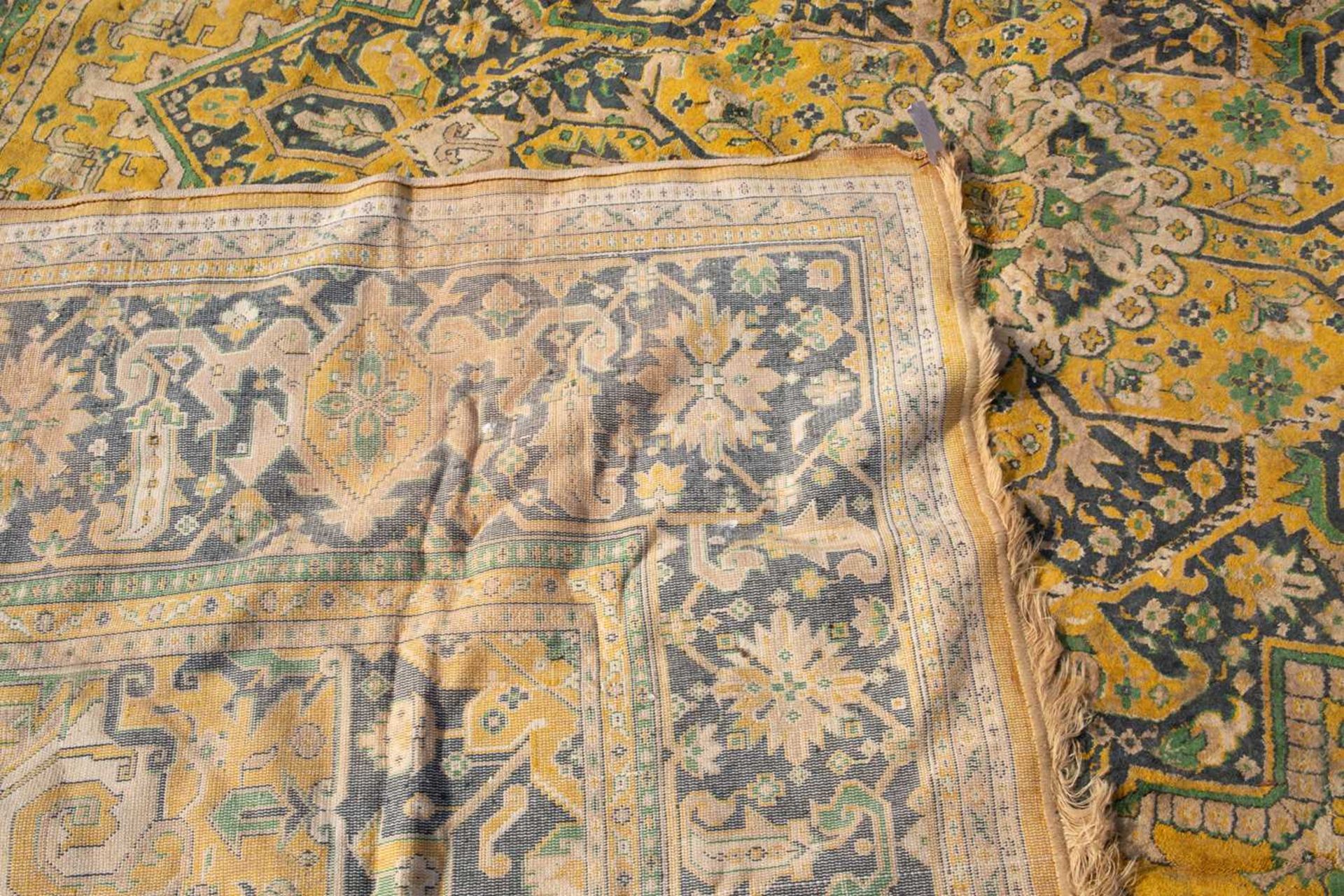 A modern 20th century blue and yellow ground small carpet, decorated with geometric designs within a - Image 3 of 4