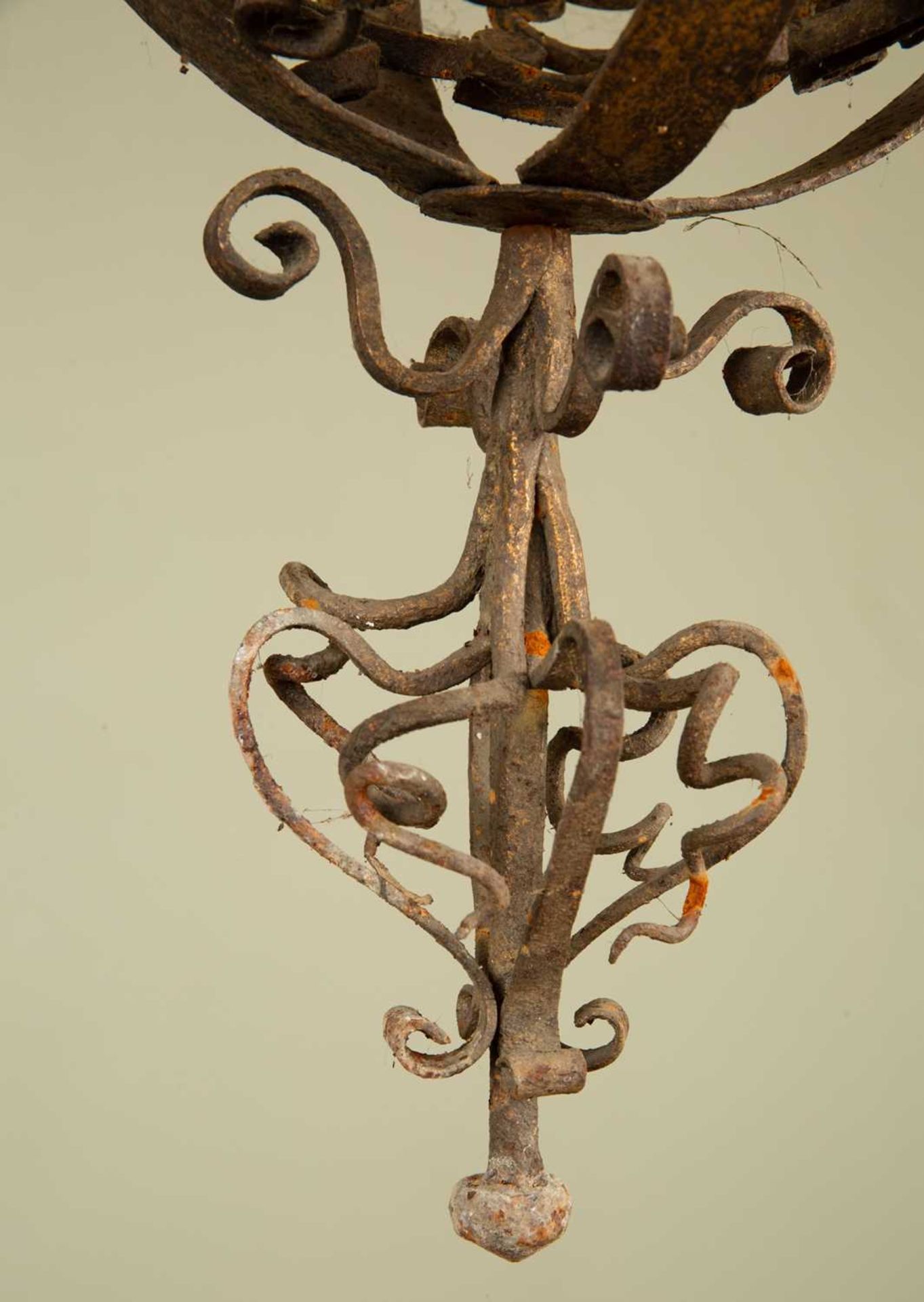 An early 20th century wrought iron hanging chandelier, the central globe with four branches and - Image 3 of 4