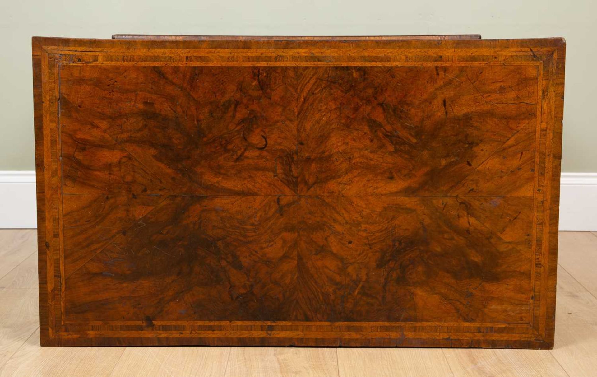 A George II walnut chest of two short and three long drawers standing on bracket feet, the quartered - Image 5 of 5