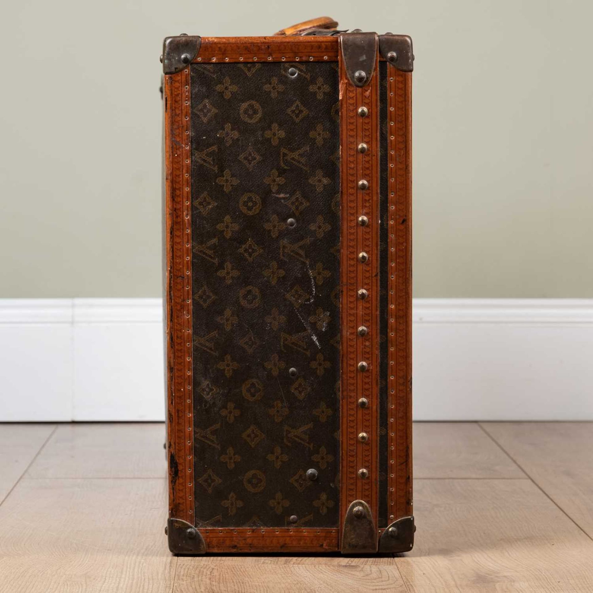 A vintage Louis Vuitton suitcase, early 20th century, with leather carrying handle, the lock - Image 5 of 11
