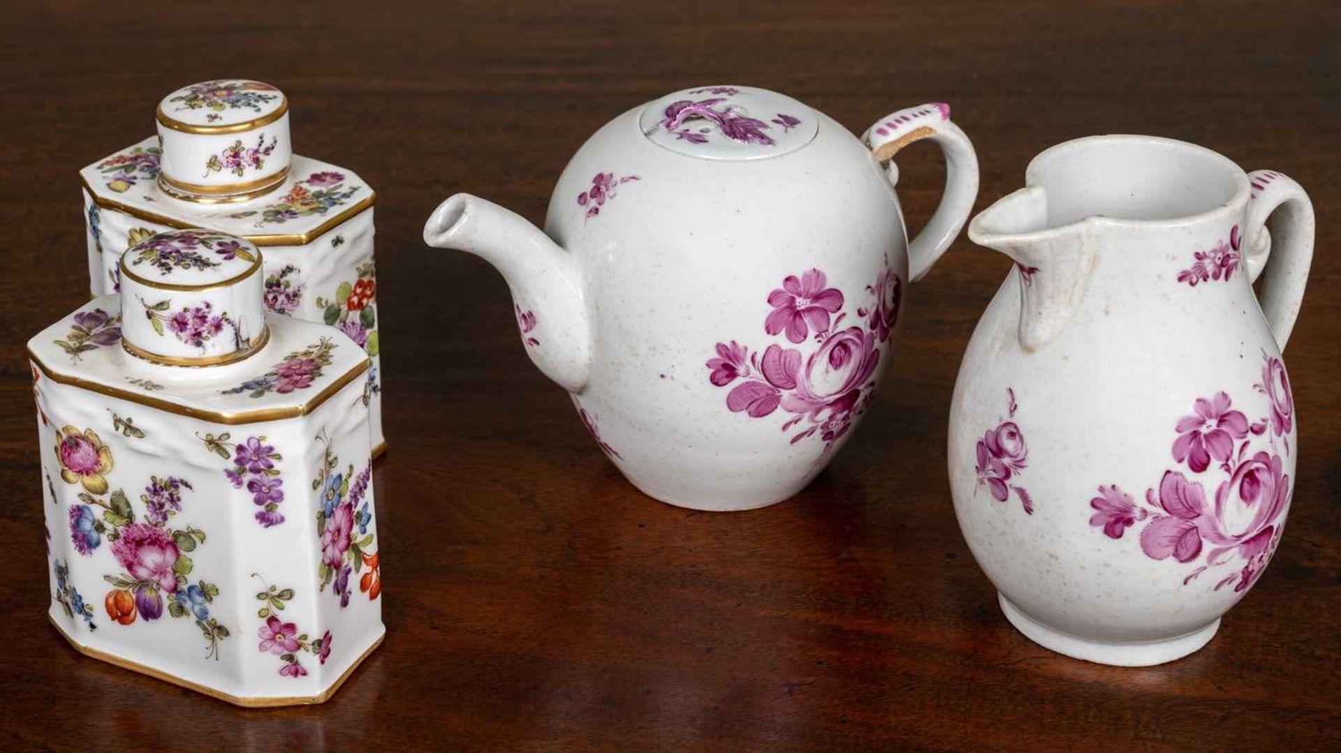 A pair of Meissen-style porcelain flower decorated tea canisters, each 9cm wide x 11.5cm high,