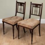 A pair of Victorian mahogany small occasional chairs with spindle turned splat, overstuffed