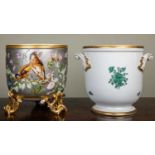 A continental porcelain jardiniere the silver ground decorated with goldfinches amongst wildflowers,