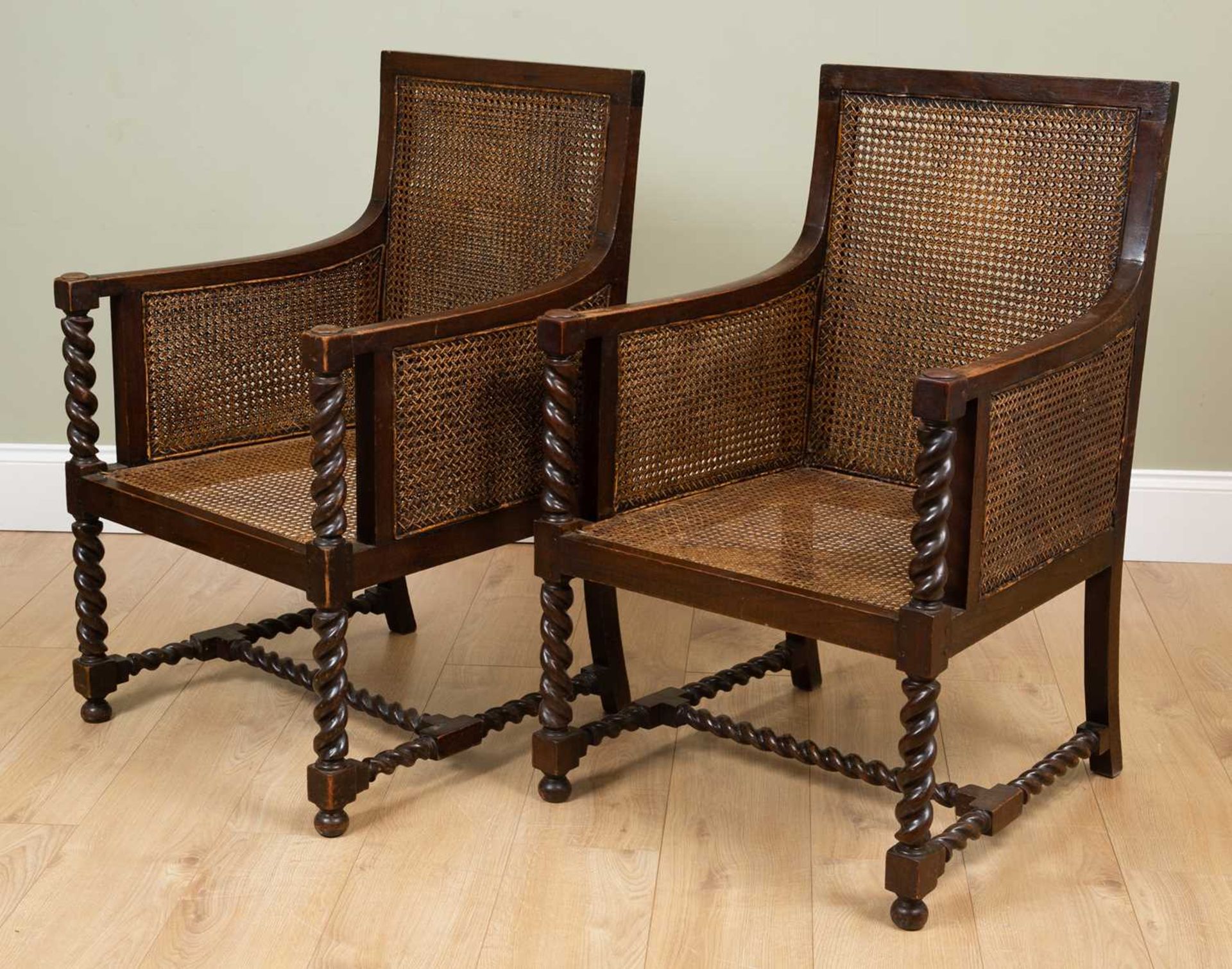 A pair of early 20th century oak framed Bergere armchairs with double caned backs and sides and with - Image 2 of 4