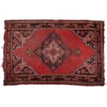 A small Turkey red ground rug together with a group of four further modern Oriental rugs (5)The