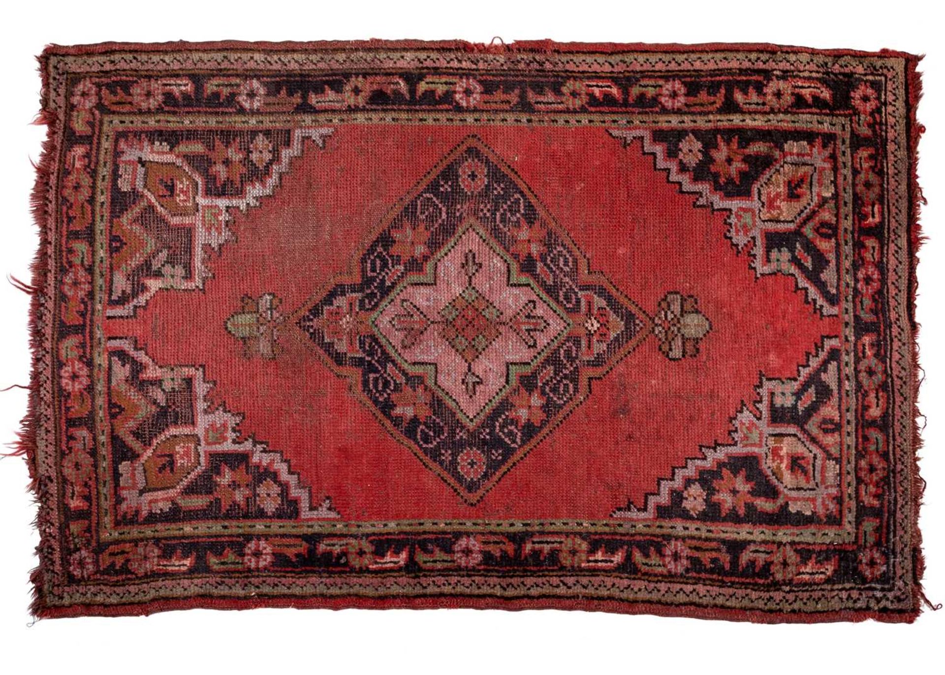 A small Turkey red ground rug together with a group of four further modern Oriental rugs (5)The