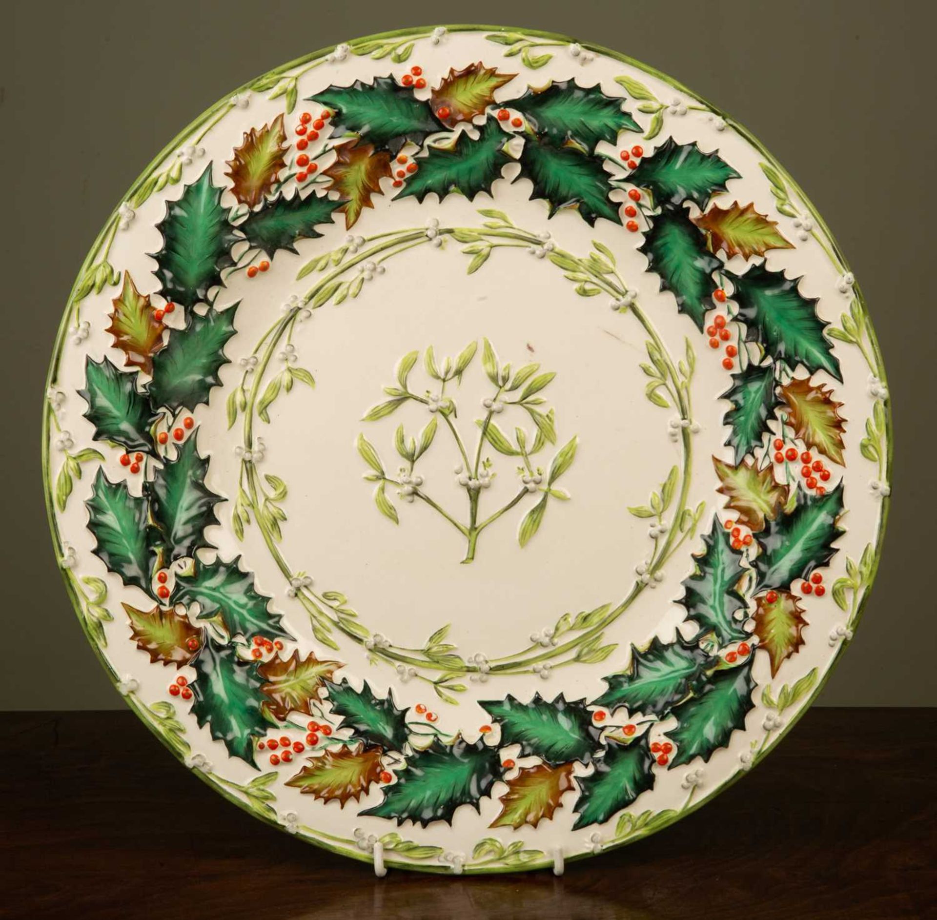 An early 20th century Copeland late Spode Christmas dish decorated in light relief with holly and