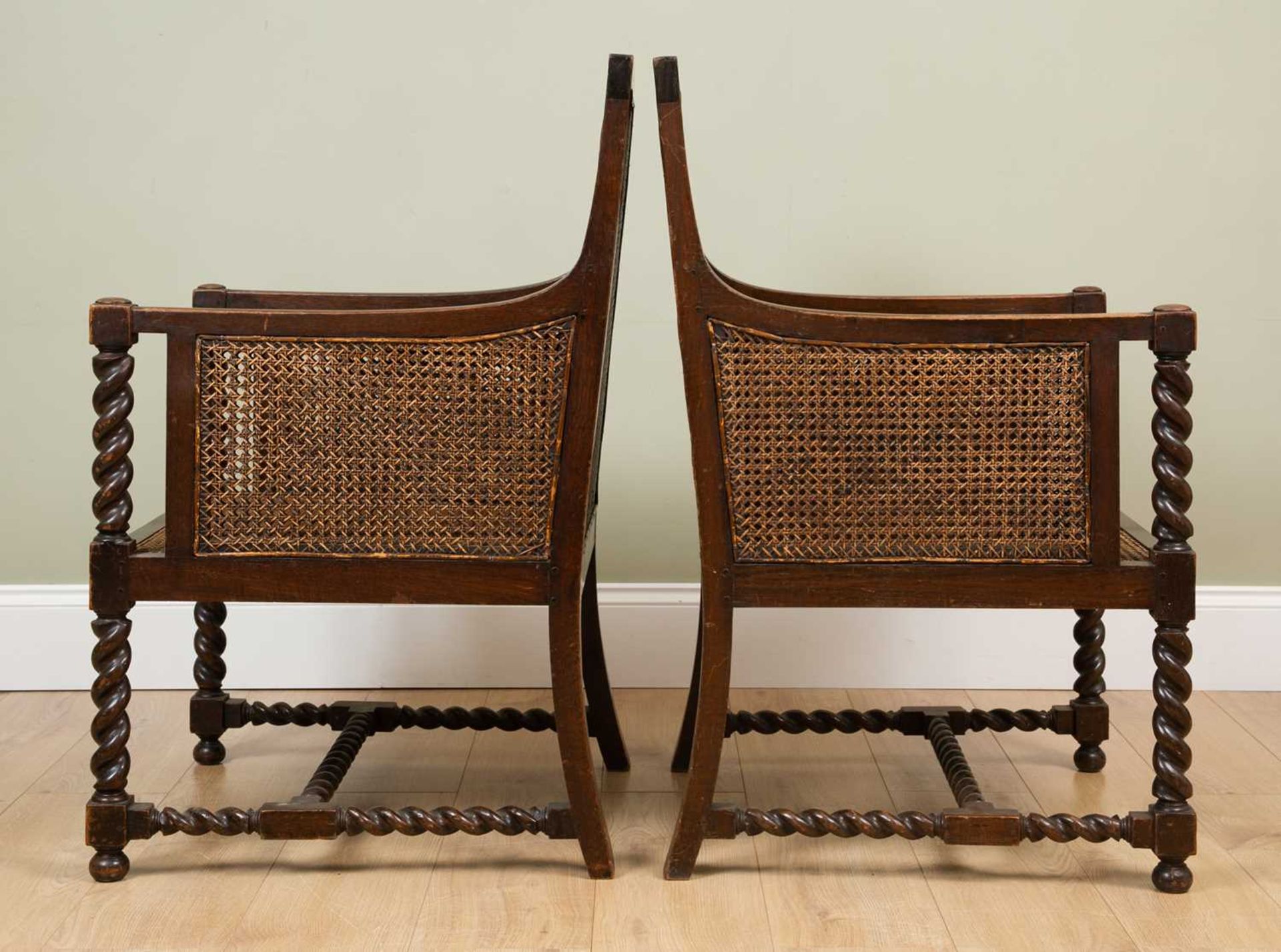 A pair of early 20th century oak framed Bergere armchairs with double caned backs and sides and with - Image 3 of 4