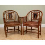 A pair of Chinese style painted bentwood and bamboo armchairs with lacquered panelled inset backs