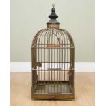 A Victorian brass bird cage of square section, with black painted turned finial, a sliding tray to