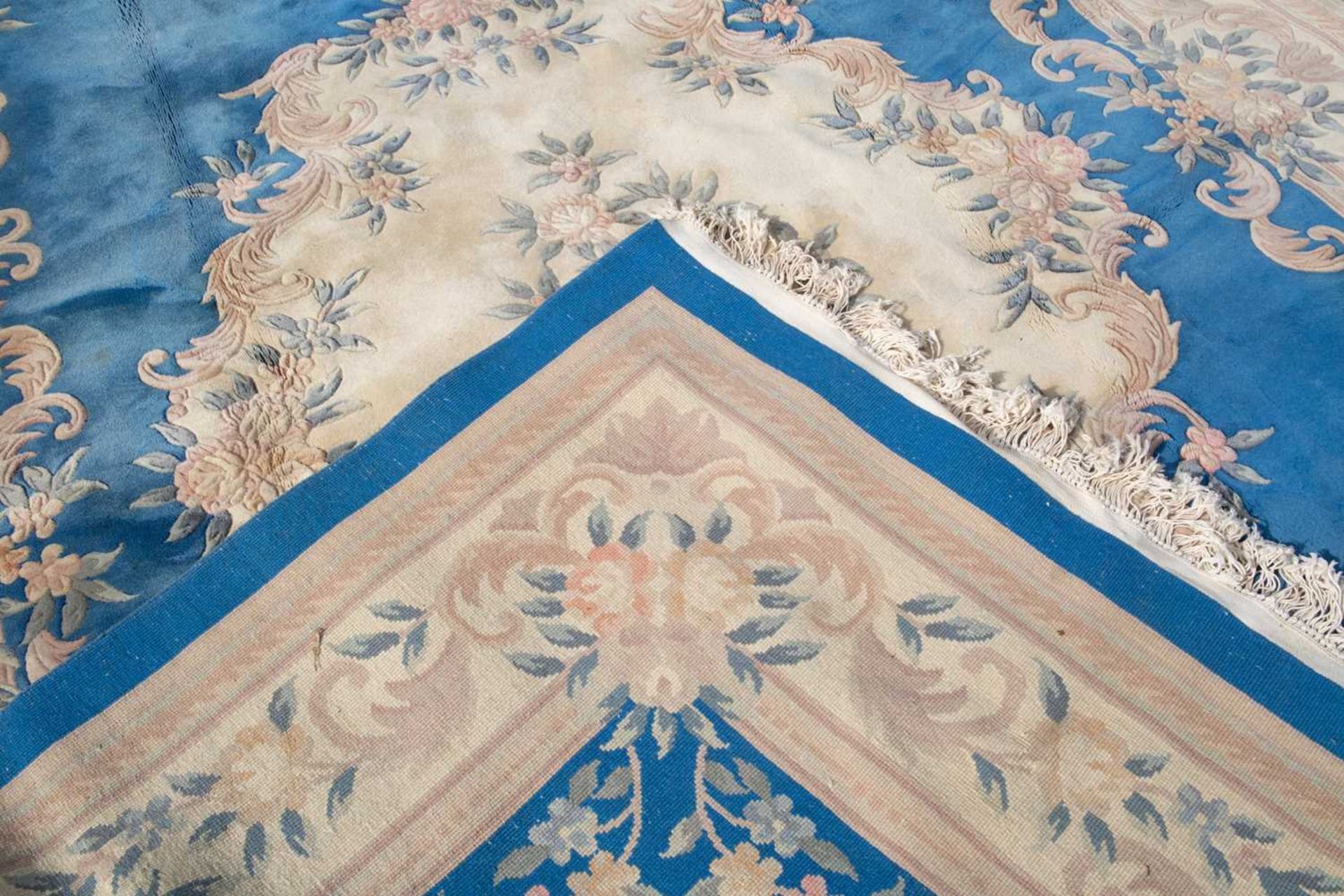 A Chinese blue ground carpet with stylized floral design and blue outer border, 367cm x 272cmFaded - Image 3 of 3