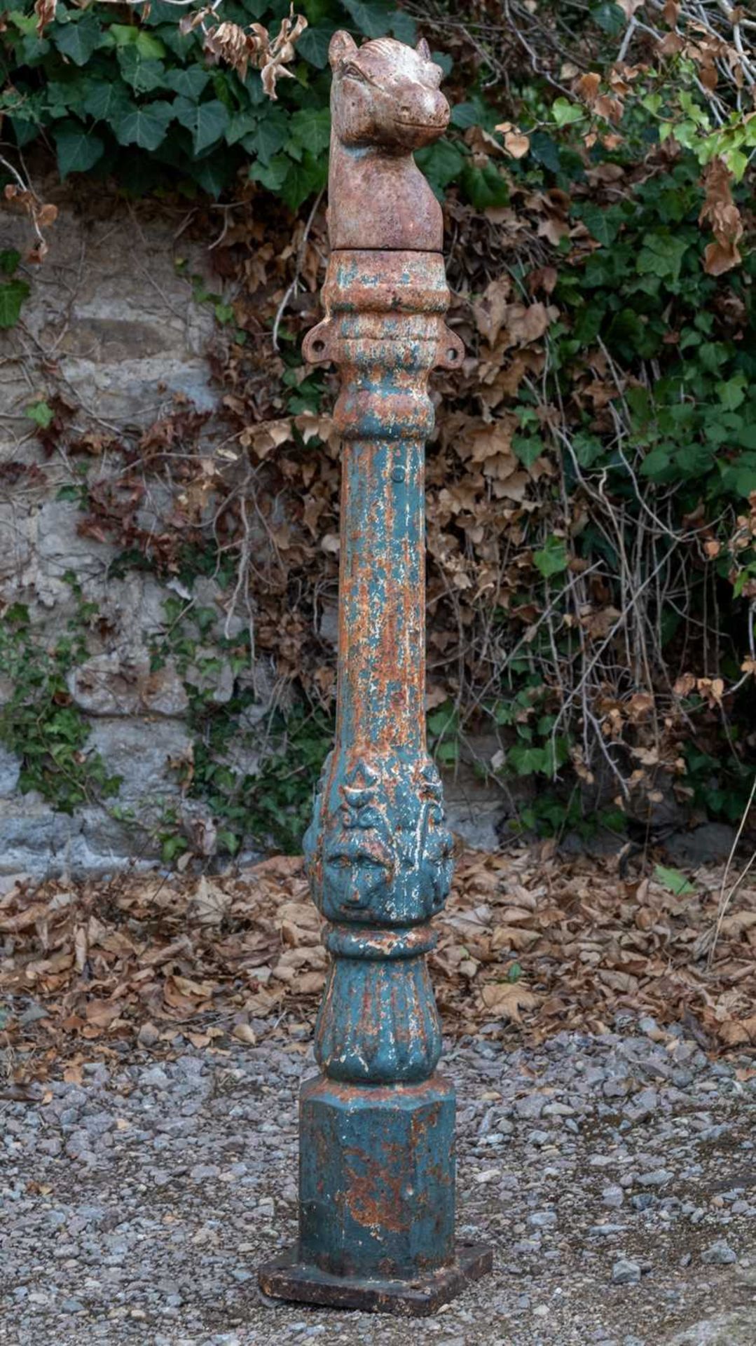 A partially painted cast iron column with horse head terminal, 121cm high overallGeneral corrosion