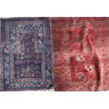 A small antique blue ground prayer mat, 132cm x 98cm; together with a small red ground tribal rug