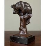 O.M. (early 20th Century German School), a young climbing bear, bronze, signed with initials 'O.