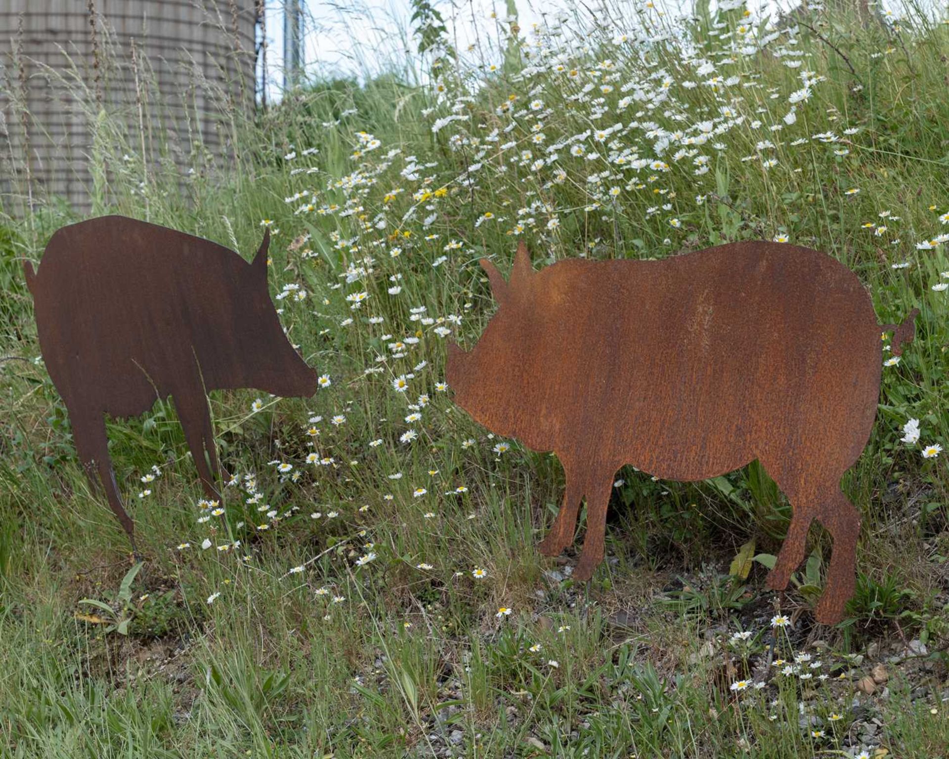 A pair of pig silhouette garden ornaments, the largest 118cm wide, 68.5cm high not including the - Image 2 of 2