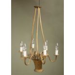 A mid 20th Century hanging light fitting, in the form of a gilt metal basket with six reeded