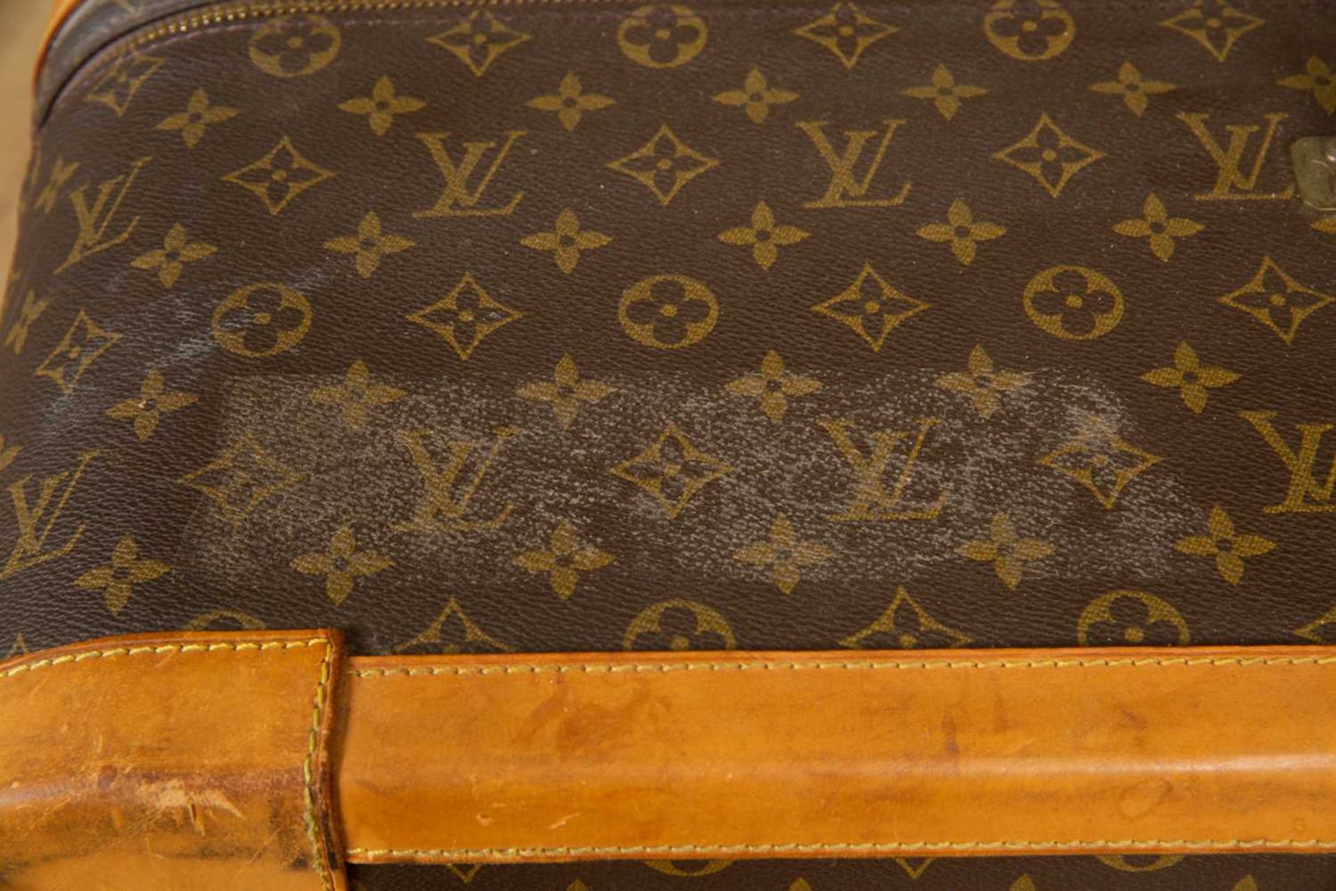 A Vintage Louis Vuitton suitcase with brass clasp and combination lock, 85cm wide x 27cm deep x 54cm - Image 4 of 8