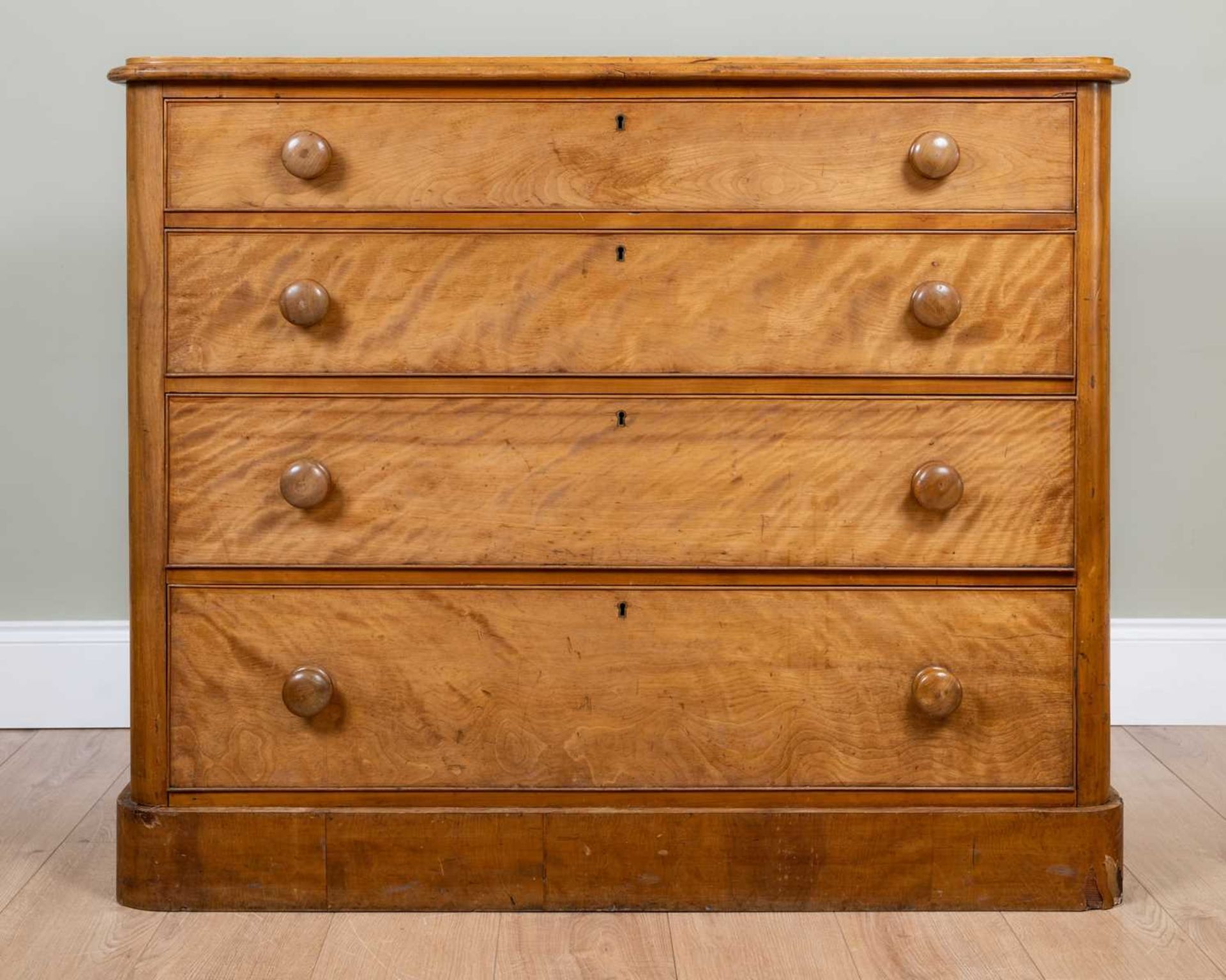 A Victorian satin birch chest of four longs graduated drawers with turned knob handles and