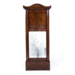 An early 19th Century mahogany pier glass, possibly French, with a bevelled glass panel and beaded