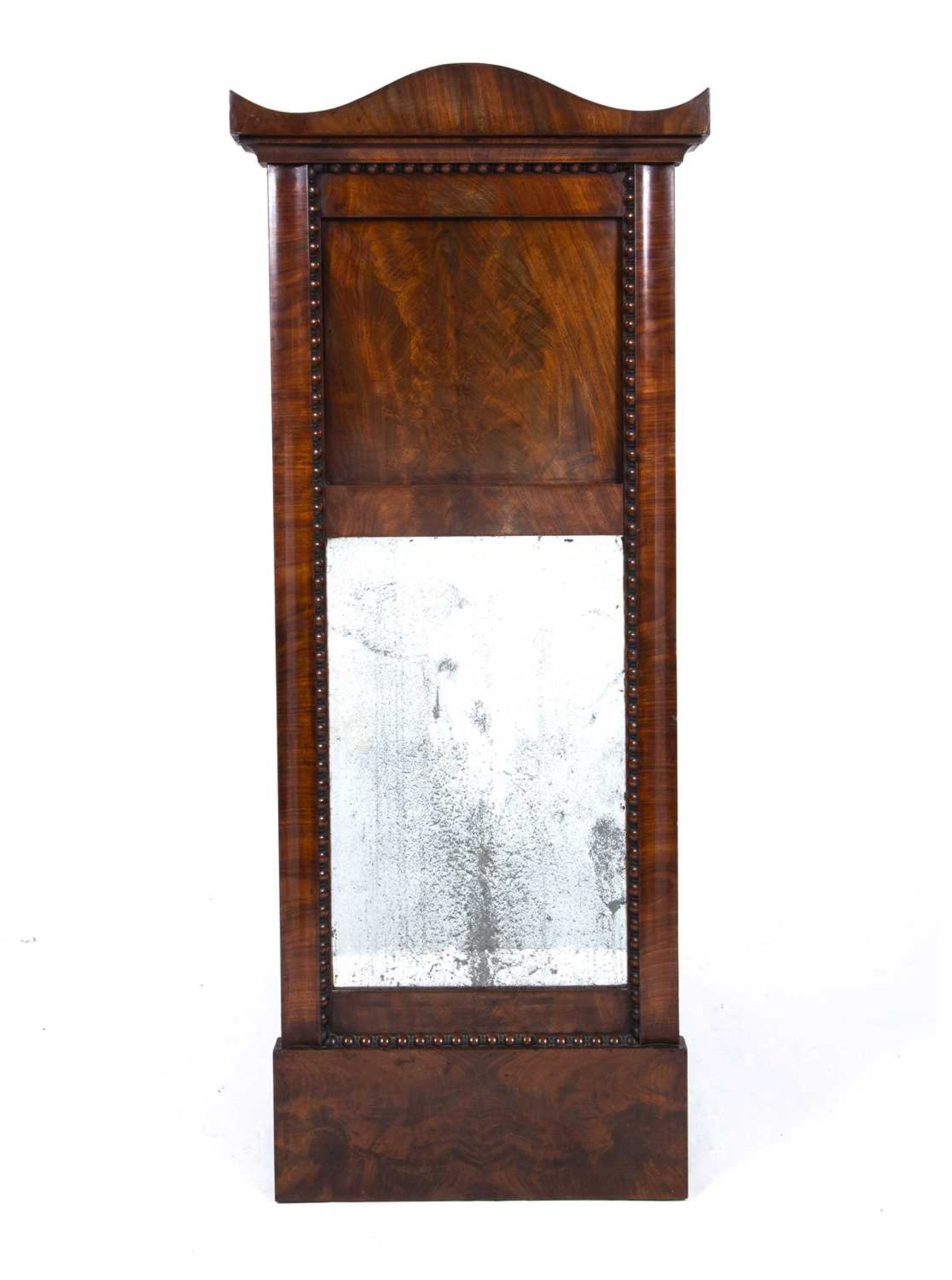 An early 19th Century mahogany pier glass, possibly French, with a bevelled glass panel and beaded