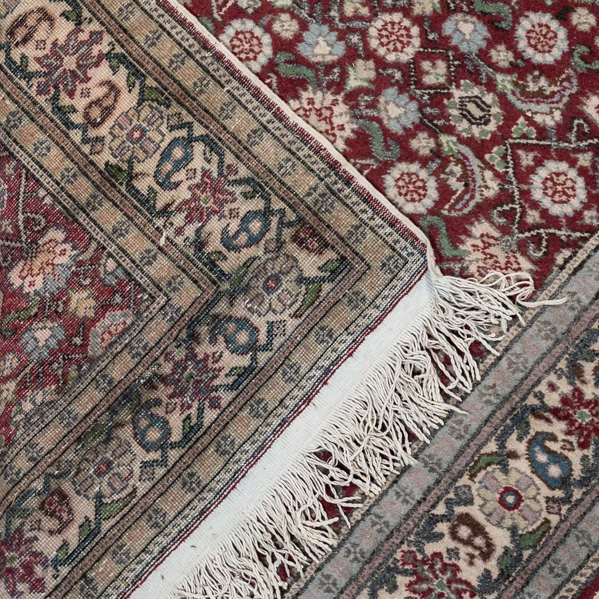 A small Turkey red ground rug together with a group of four further modern Oriental rugs (5)The - Image 8 of 11