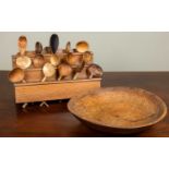 An antique sycamore dairy bowl, 37.5cm diameter; together with a pine spoon rack with a collection