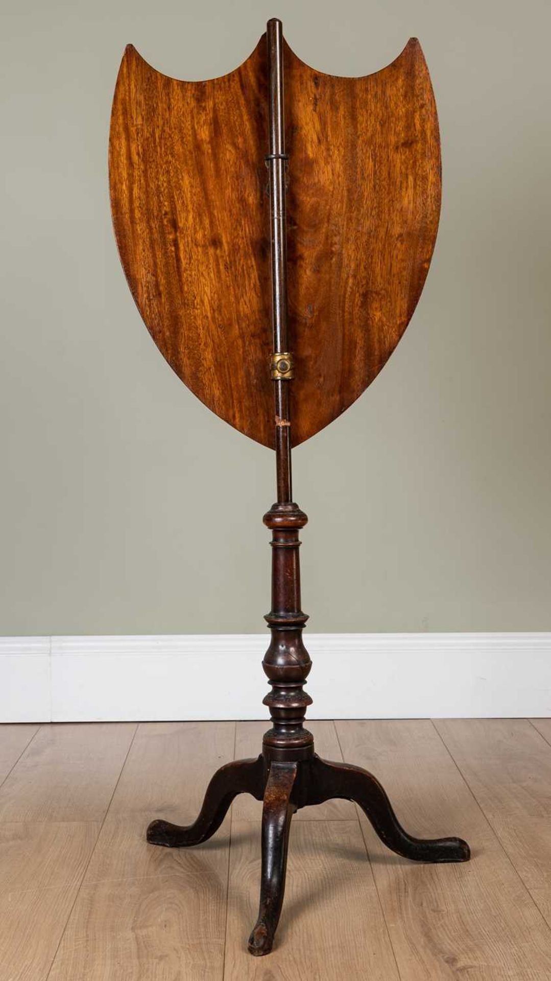 A 19th century mahogany pole screen, the shield shaped carved screen decorated with a heraldic - Image 3 of 3