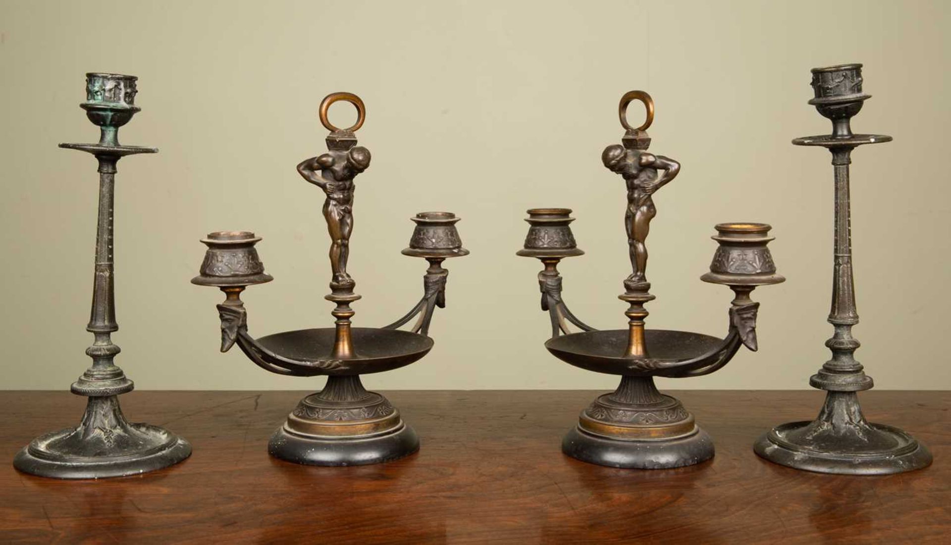 A pair of 19th century continental small candelabra in the classical form with central Atlas figures