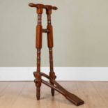 An antique walnut boot jack with twin handles, 39cm wide x 85cm highIn used condition with minor